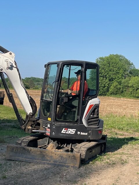 Mark Manyen operating Bobcat excavator on jobsite