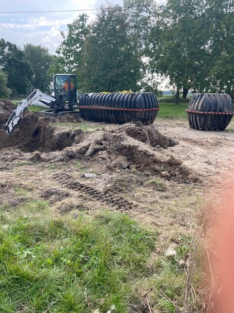 Septic tanks set in trench during installation